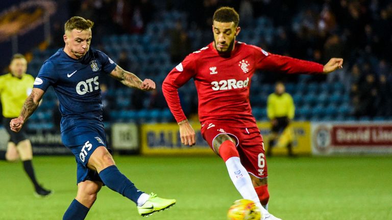 Eamonn Brophy escapes Connor Goldson to fire his shot into the bottom corner