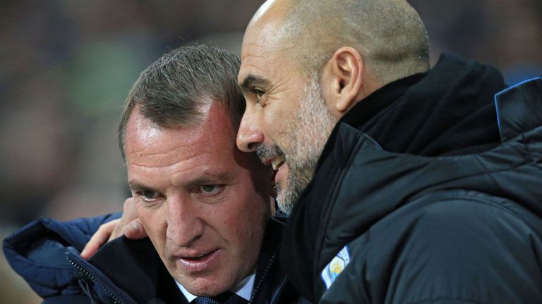Pep Guardiola (R) chats with Leicester manager Brendan Rodgers (L)