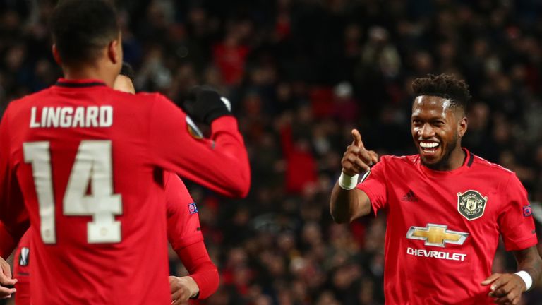 Fred celebrates with Jesse Lingard after his first goal