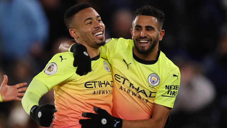 Gabriel Jesus celebrates with Riyad Mahrez after scoring against Leicester City