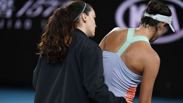 Garbine Muguruza receives medical attention as she plays against Sofia Kenin of the US in their women's singles final match on day thirteen of the Australian Open tennis tournament in Melbourne on February 1, 2020