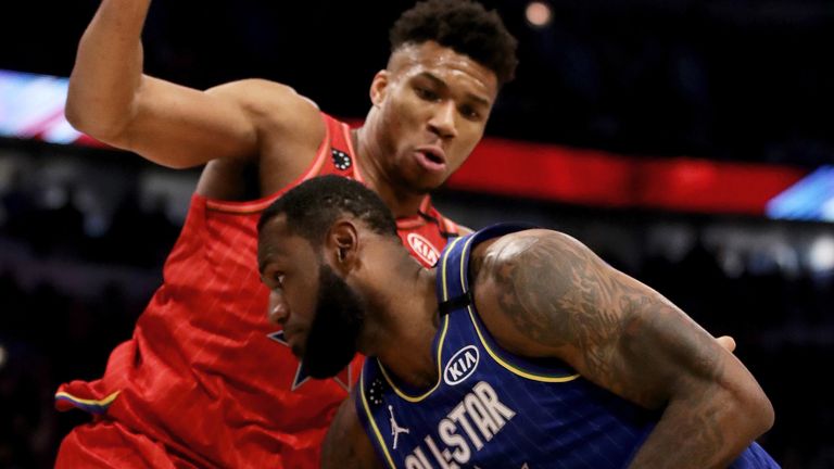 Giannis Antetokounmpo puts defensive pressure on LeBron James during the All-Star Game