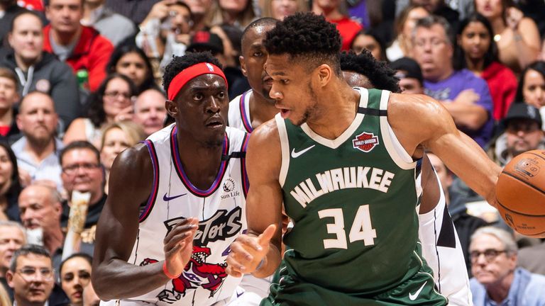 Giannis Antetokounmpo backs down Pascal Siakam during the Bucks'  road win over the Raptors