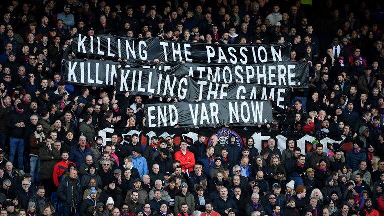 Supporters hold up an anti_VAR banner during the English Premier League football match between Crystal Palace and Arsenal at Selhurst Park in south London on January 11, 2020