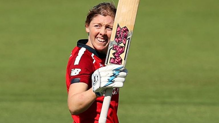 Heather Knight of England celebrates scoring a century during the ICC Women's T20 Cricket World Cup match between England and Thailand at Manuka Oval on February 26, 2020 in Canberra, Australia