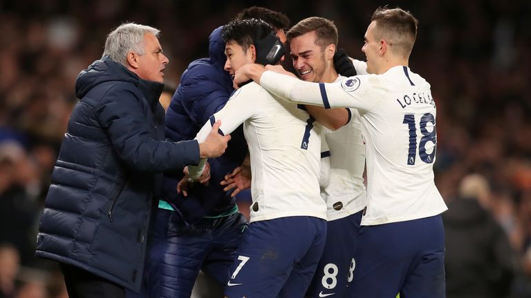 Heung-Min Son celebrates with Tottenham team-mates and head coach Jose Mourinho
