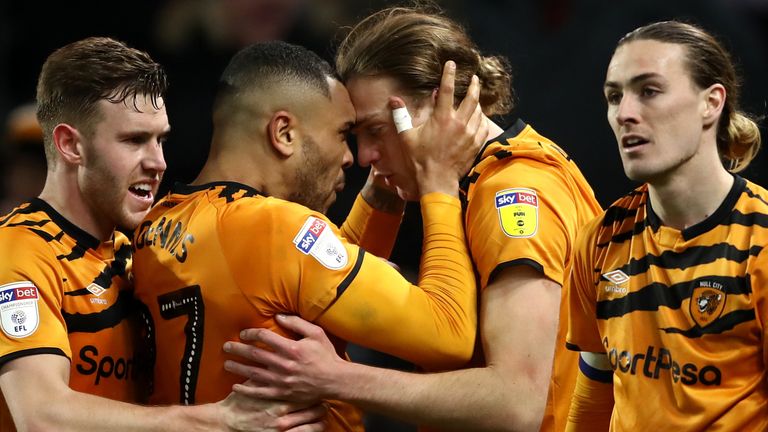 Hull City's Tom Eaves (centre right) celebrates scoring his side's fourth goal of the game vs Swansea with teammate Josh Magennis during the Sky Bet Championship match at the KCOM Stadium, Hull.