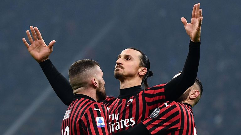 AC Milan's forward Zlatan Ibrahimovic from Sweden (C) celebrates with his teammates after scoring a goal during the Italian Serie A football match Inter Milan vs AC Milan on February 9, 2020 at the San Siro stadium in Milan. (Photo by MARCO BERTORELLO / AFP) (Photo by MARCO BERTORELLO/AFP via Getty Images)