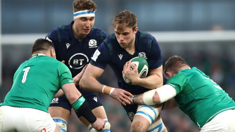 Jonny Gray is tackled by Cian Healy