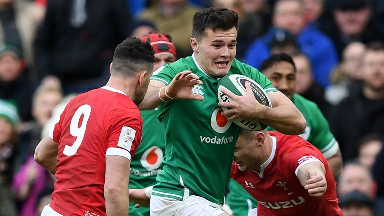 Jacob Stockdale takes on Tomos Williams