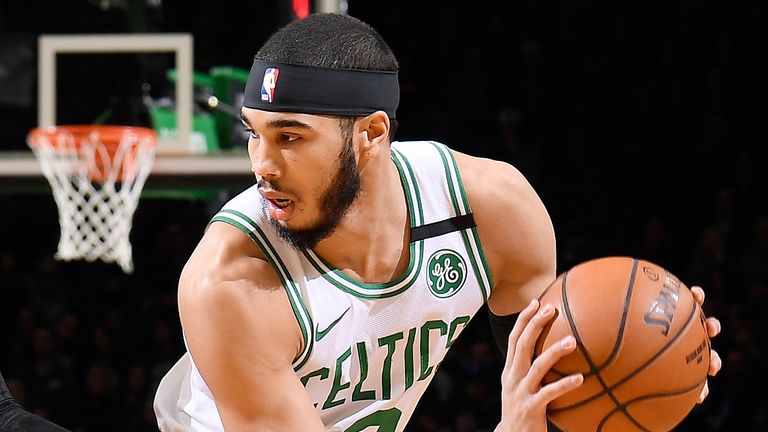 Jayson Tatum protects the ball against Orlando