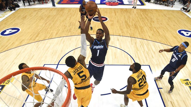 Joe Johnson of the Triplets takes a shot over C.J. Watson, Stephen Jackson, and Donte Greene of Killer 3s during the BIG3 Championship at Staples Center in September