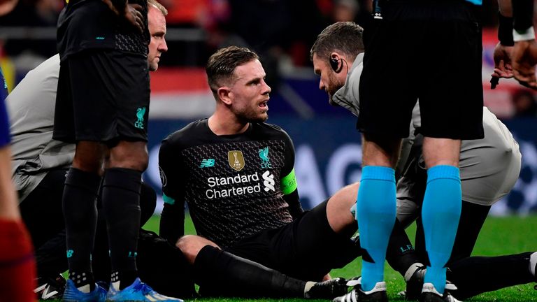 Jordan Henderson receives treatment before being subbed off in Madrid