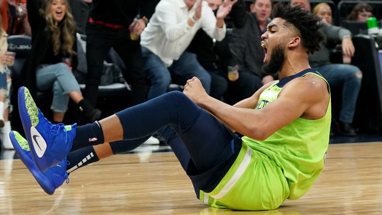 Karl-Anthony Towns celebrates a basket against the Clippers