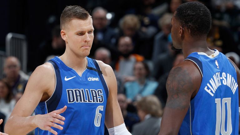 Kristaps Porzingis celebrates a play with Mavericks team-mate Dorian Finney-Smith