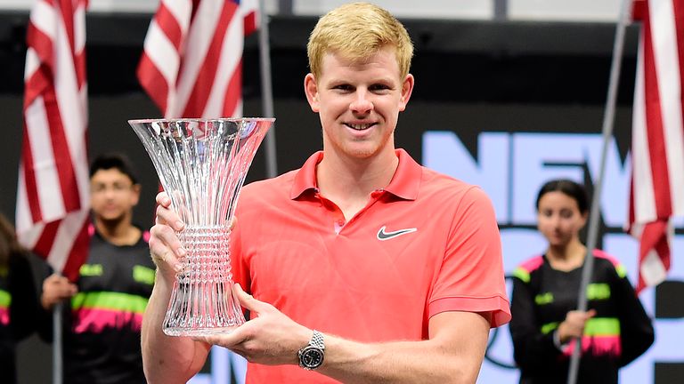 Kyle Edmund of Great Britain celebrates with the winners trophy after winning his Men's Singles final match against Andreas Seppi of Italy on day seven of the 2020 NY Open at Nassau Veterans Memorial Coliseum on February 16, 2020 in Uniondale, New York