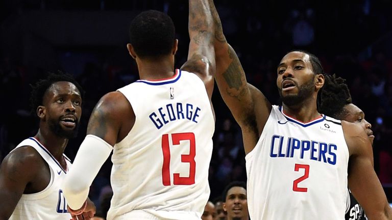Paul George and Kawhi Leonard high-five during the Clippers win over the Spurs