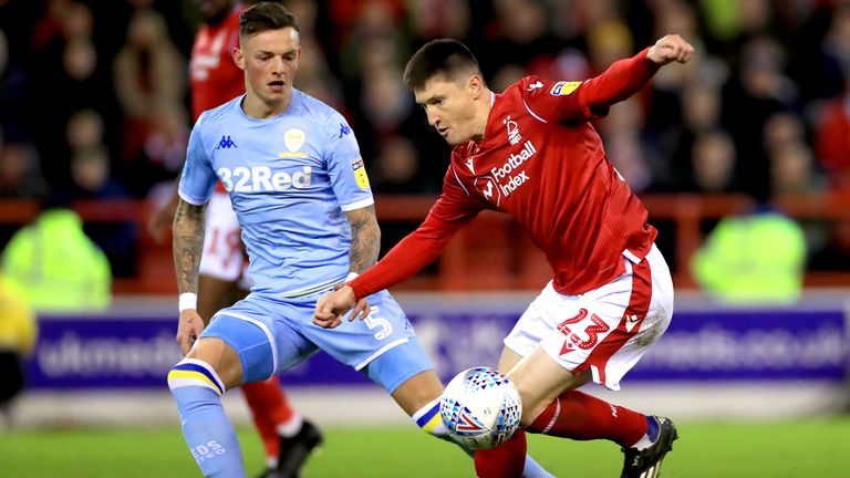 Ben White and Joe Lolley battle for possession