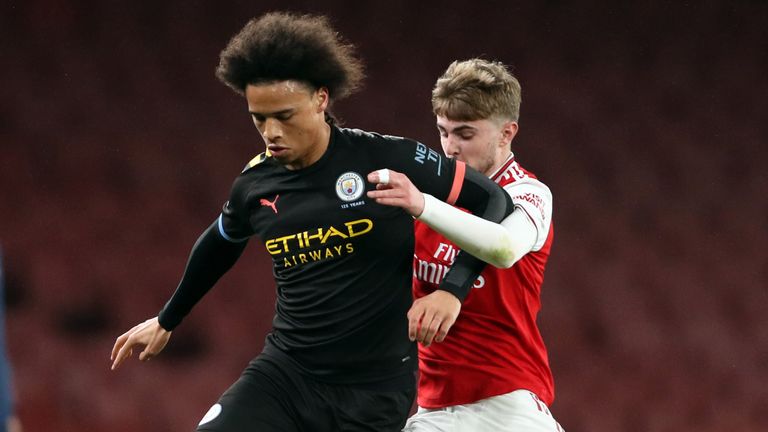 Leroy Sane battles for possession with Zak Swanson during the Premier League 2 match between Arsenal U23 and Manchester City U23