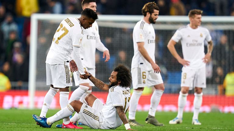 Marcelo and Real team-mates look dejected during the defeat