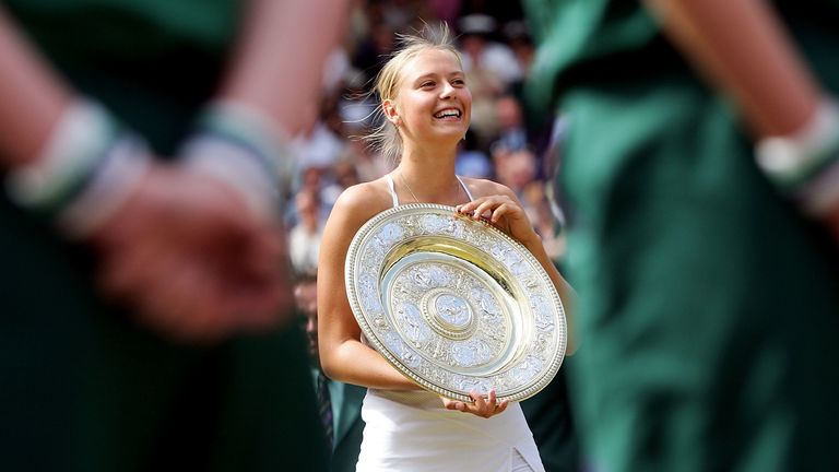 Maria Sharapova with the trophy after defeating Serena Williams in the Wimbledon final on July 3, 2004