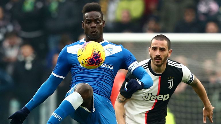 Brescia's Mario Balotelli challenges Juventus defender Leonardo Bonucci