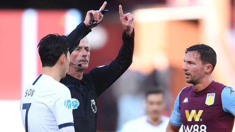 Referee Martin Atkinson awards Tottenham a penalty on the stroke of half-time