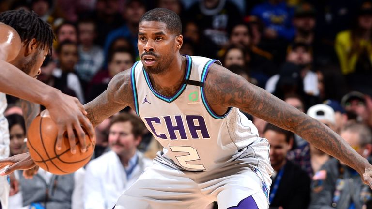 Marvin Williams faces up to Denver Nuggets' Jerami Grant