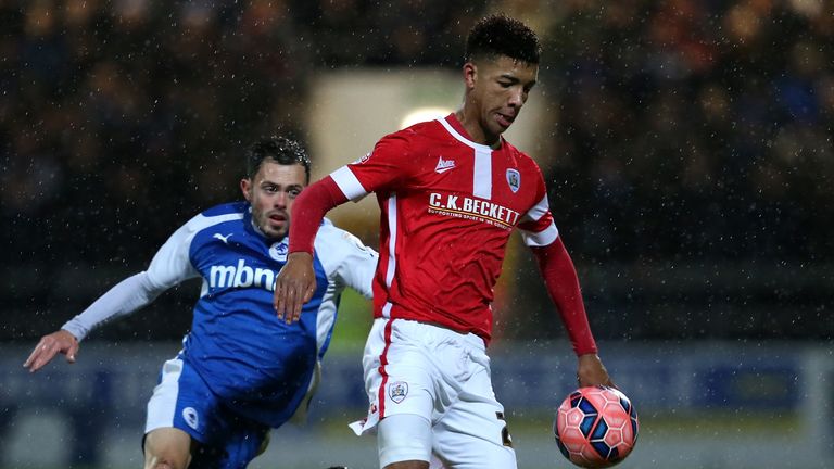 Holgate in action for Barnsley as an 18-year-old in December 2014