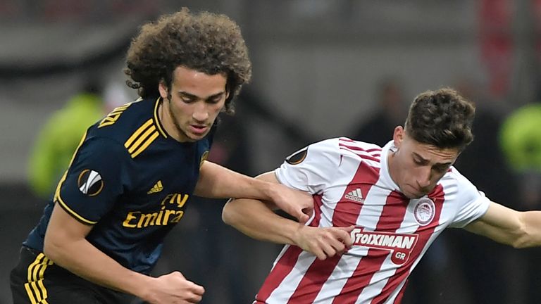 Arsenal's Matteo Guendouzi vies with Olympiakos' Konstantinos Tsimika