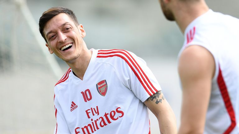 Mesut Ozil appeared in good spirits during warm-weather training in Dubai