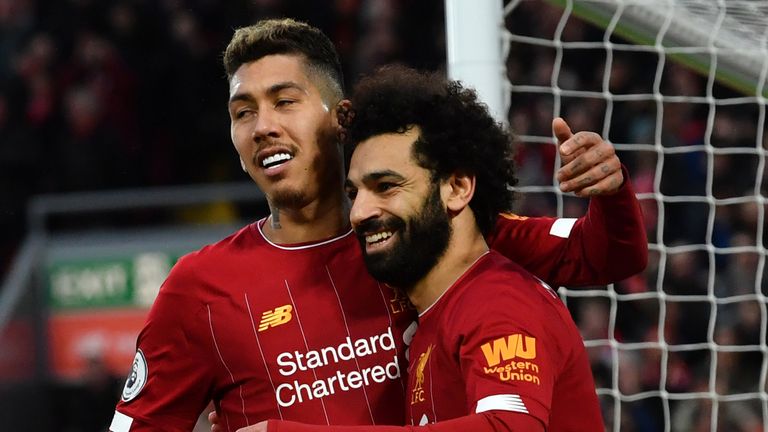 Mohamed Salah and Roberto Firmino celebrate a goal against Southampton