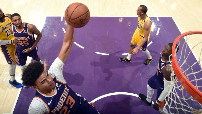 Cameron Johnson of the Phoenix Suns hits a dunk at the La Lakers