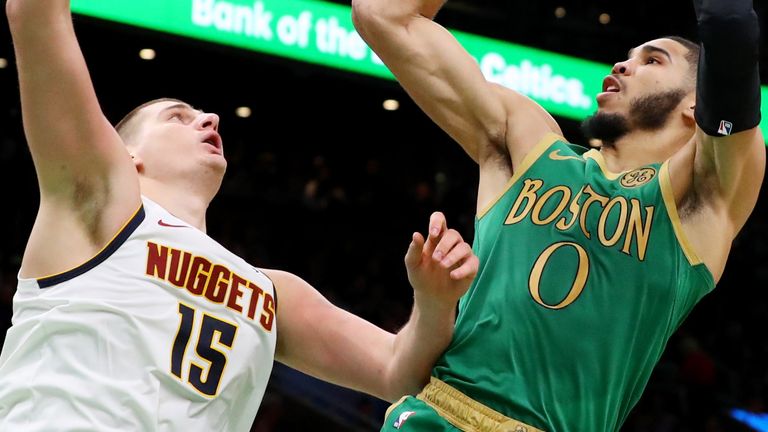 Jayson Tatum shoots a fadeaway over Nikola Jokic 