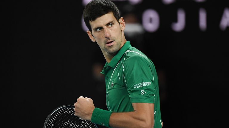 Serbia's Novak Djokovic reacts as he plays against Austria's Dominic Thiem during their men's singles final match on day fourteen of the Australian Open tennis tournament in Melbourne on February 2, 2020.