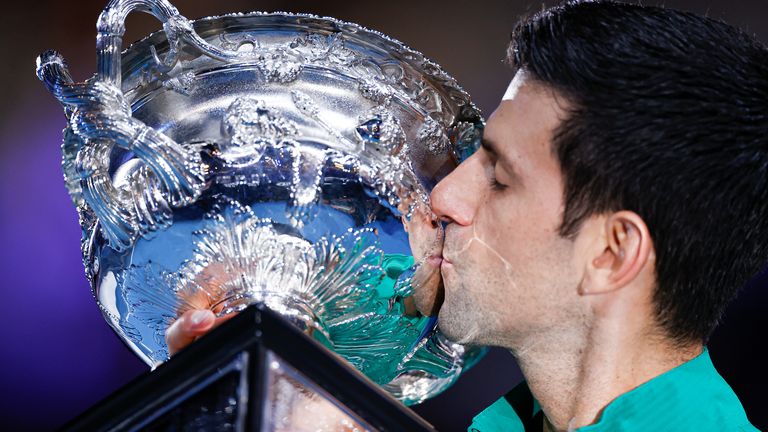 Novak Djokovic of Serbia kisses the Norman Brookes Challenge Cup after winning the Men's Singles Final against Dominic Thiem of Austria on day fourteen of the 2020 Australian Open at Melbourne Park on February 02, 2020 in Melbourne, Australia.