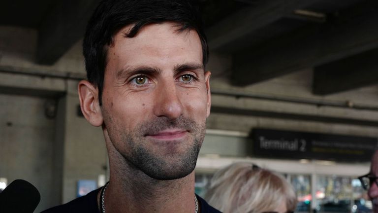 Serbia's Novak Djokovic answers journalists' questions as he arrives at Nice's airport, southern France, on February 4, 2020, two days after winning the men's singles final match of the Australian Open tennis tournament.