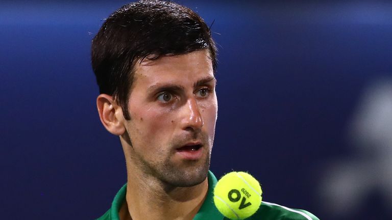 Novak Djokovic of Serbia looks on against Malek Jaziri of Tunisia during his men's singles match on Day Eight of the Dubai Duty Free Tennis at Dubai Duty Free Tennis Stadium on February 24, 2020 in Dubai, United Arab Emirates