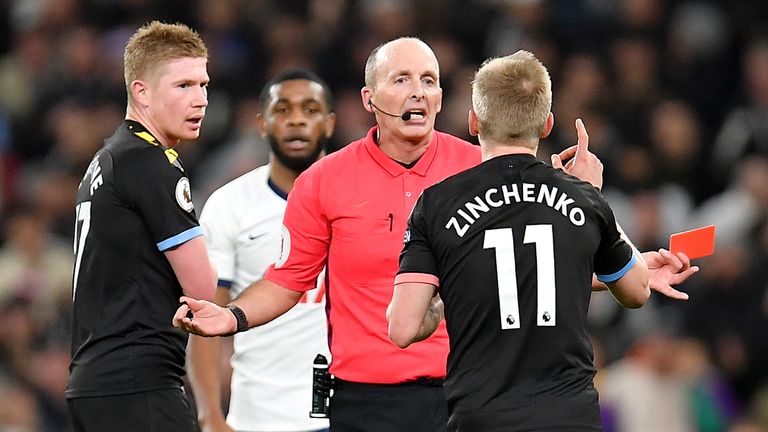 Oleksandr Zinchenko of Manchester City reacts after being sent off by Mike Dean