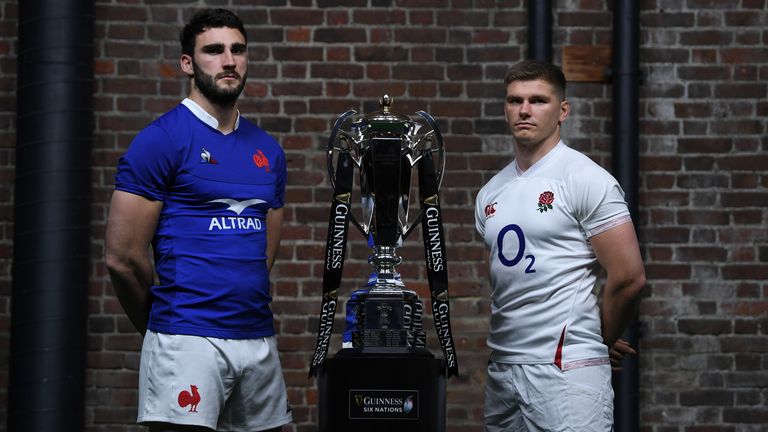 Charles Ollivon and Owen Farrell pose with the Six Nations trophy