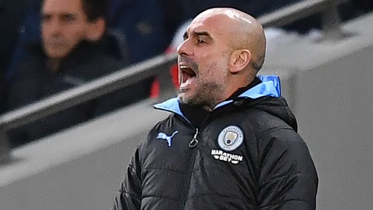 Pep Guardiola gestures on the touchline during Manchester City's game at Spurs