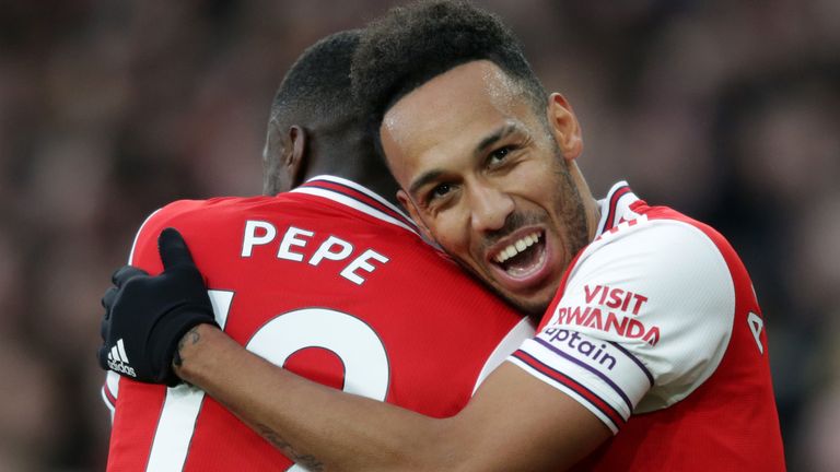 Pierre-Emerick Aubameyang celebrates with Nicolas Pepe after making it 3-2 to Arsenal against Everton