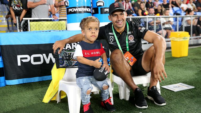 Quaden Bayles looks on from the sideline with Cody Walker of the Indigenous All-Stars