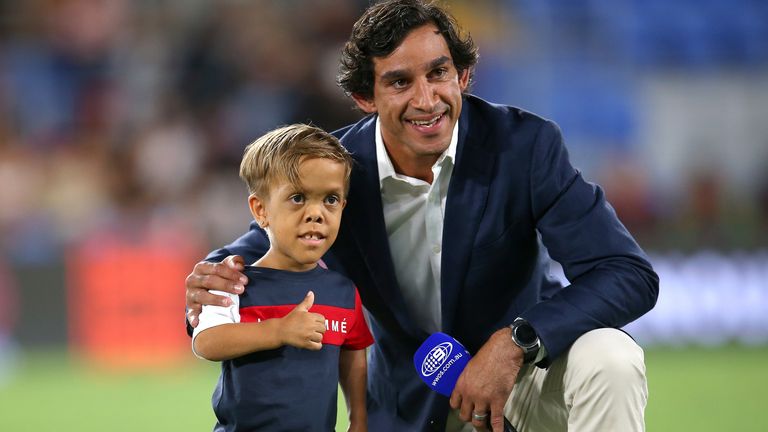 Former rugby league player Johnathan Thurston (R) poses for a photo with Quaden Bayles before kick-off