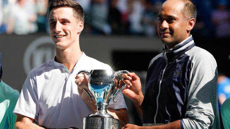 Rajeev Ram of the United States and Joe Salisbury of Great Britain hold aloft the championship trophy following their Men's Doubles Finals match against Max Purcell of Australia and Luke Saville of Australia on day fourteen of the 2020 Australian Open at Melbourne Park on February 02, 2020 in Melbourne, Australia.