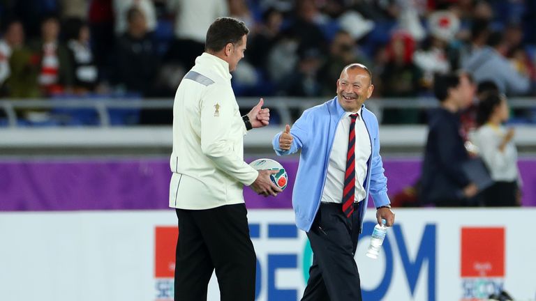 Rassie Erasmus  (L) and Eddie Jones wish each other luck ahead of the 2019 World Cup Final