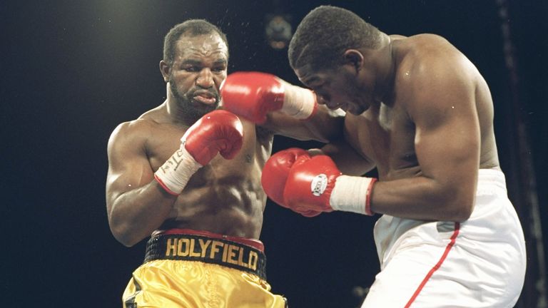 Heavyweight legends Riddick Bowe and Evander Holyfield exchange blows