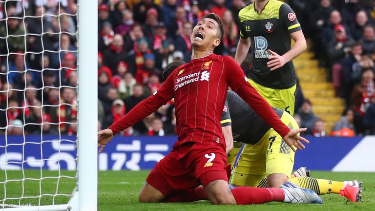 Roberto Firmino goes down the penalty area