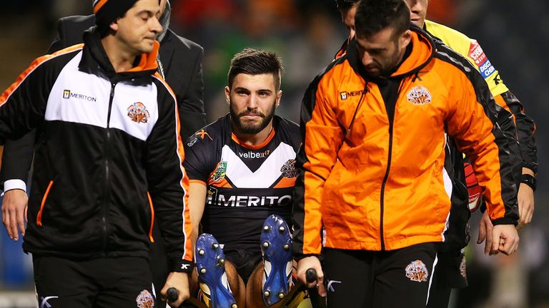 James Tedesco suffers an injury while playing for Wests Tigers in 2014