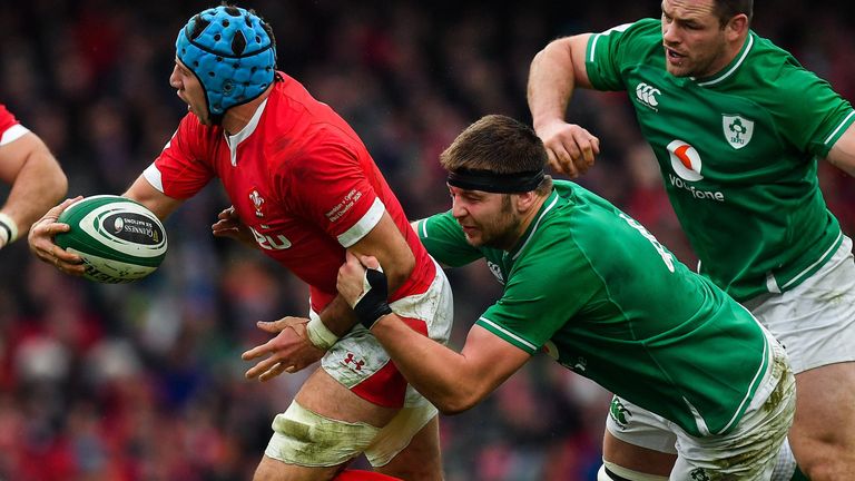 Justin Tipuric is tackled by Ireland's Iain Henderson